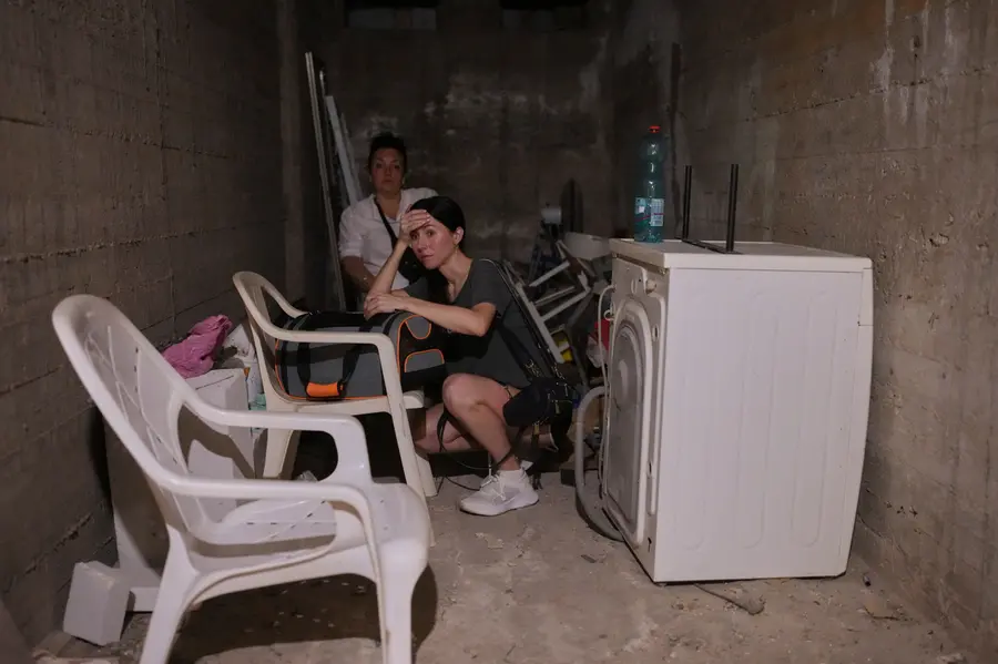 Israeli locals stay in a shelter of a residential area | AFP
