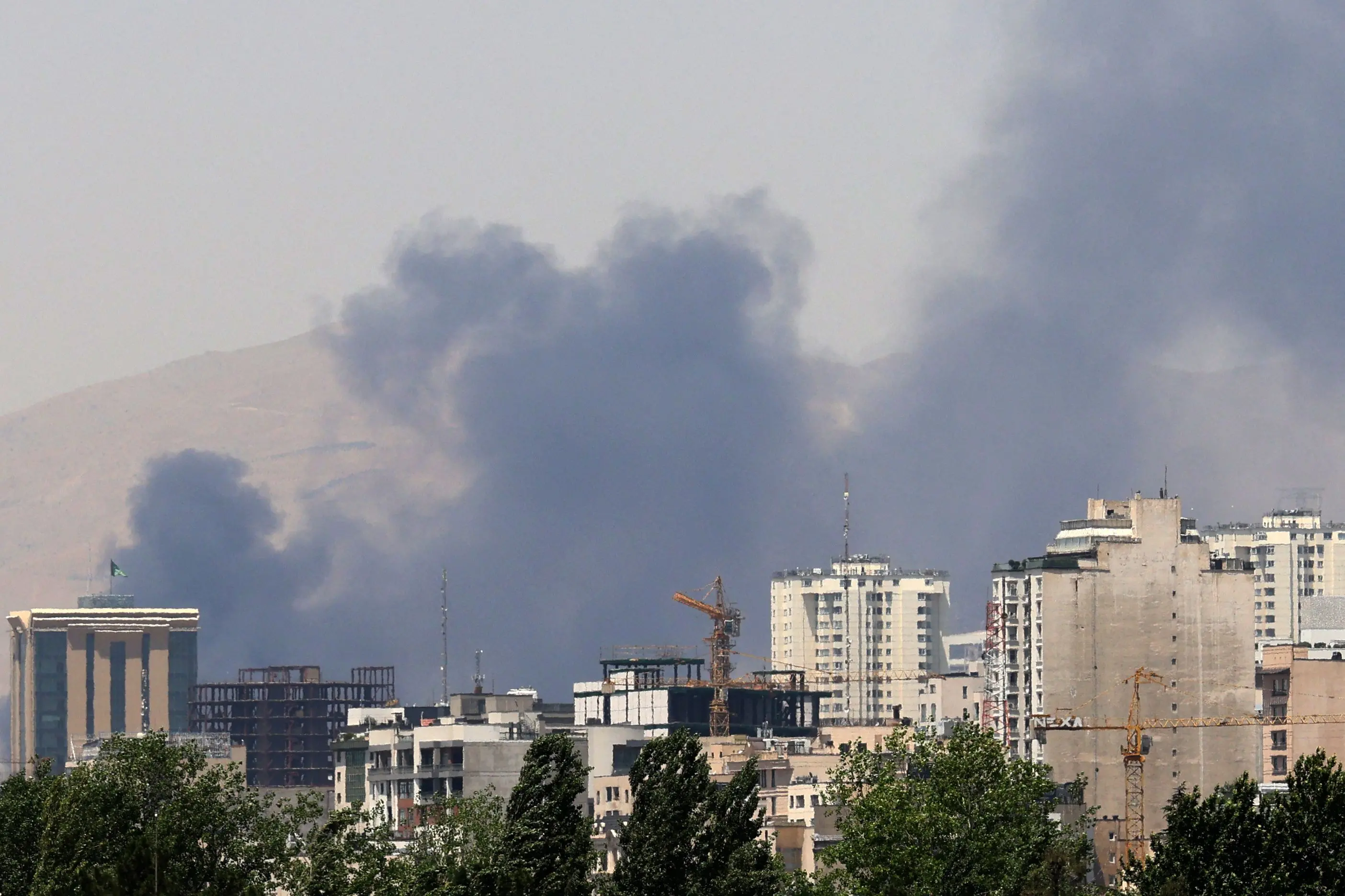 Smoke billows for the second day from the Shahran oil depot, northwest of Tehran | AFP