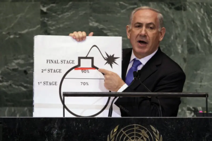 Benjamin Netanyahu shows an illustration