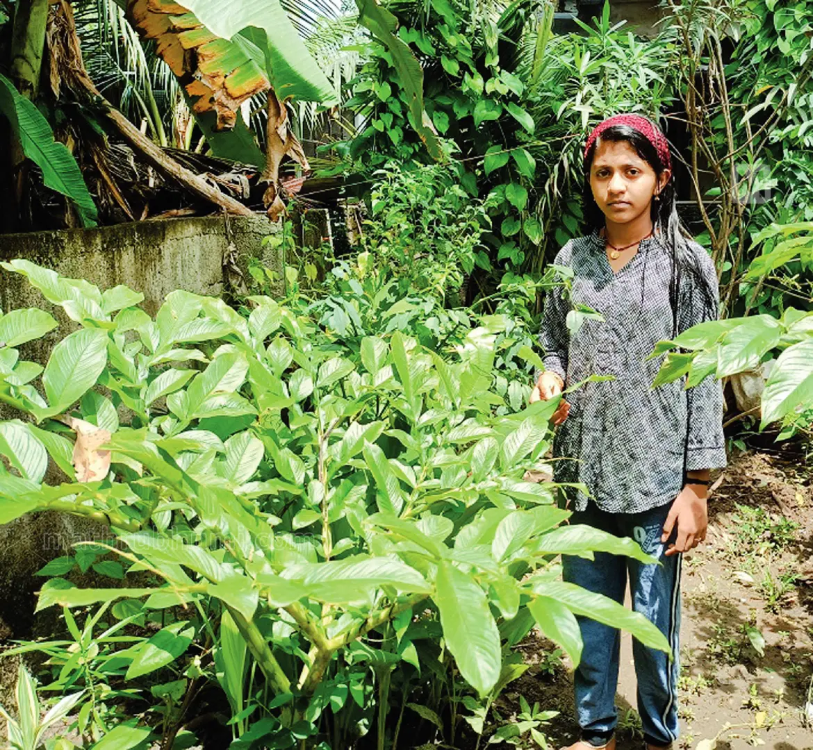 Amalu Sinoy in her vegetable garden