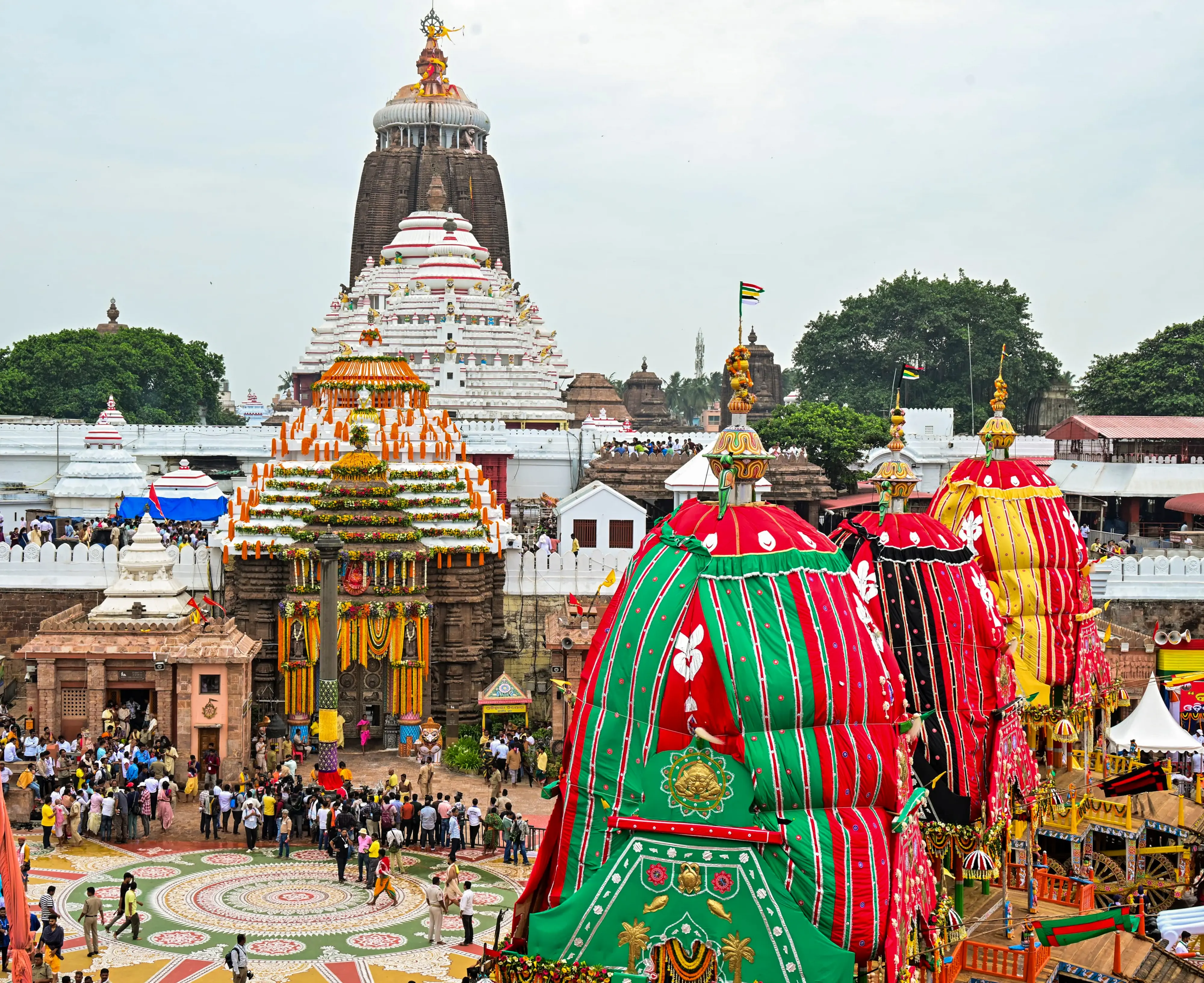 Security personnel and devotees near the chariots of Lord Jagannath, Balabhadra and Devi Subhadra | Photo: PTI