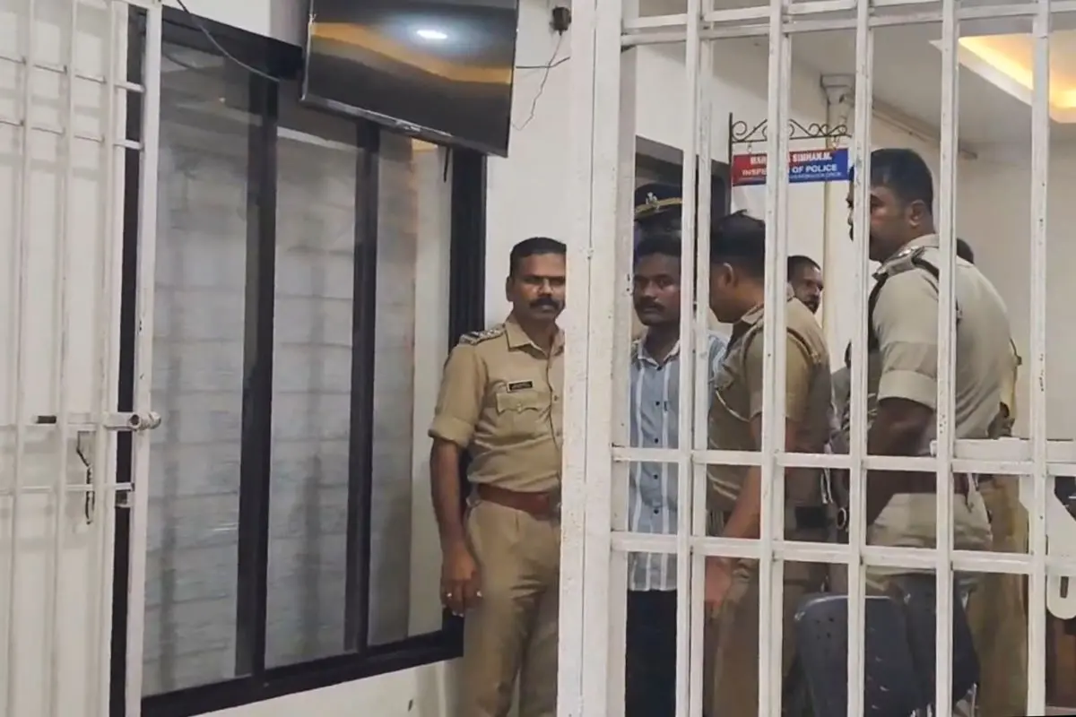 Police personnel with 25-year-old Bavin, in gray shirt, at Pudukad police station, in Thrissur district, Kerala, Sunday, June 29, 2025 (Photo: PTI)