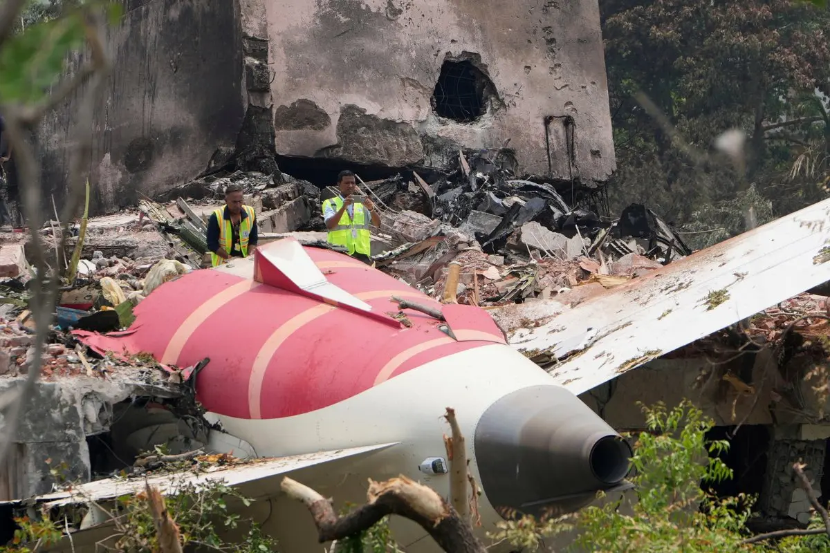 Officials inspect the site of Air India plane crash on the roof of a building in Ahmedabad | File photo: AP