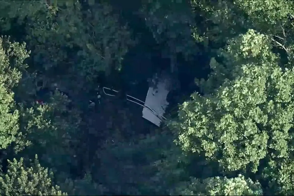 This image taken from video provided by WPVI-TV/6ABC shows a small skydiving aircraft that went off the end of a runway at New Jersey (Photo: AP)