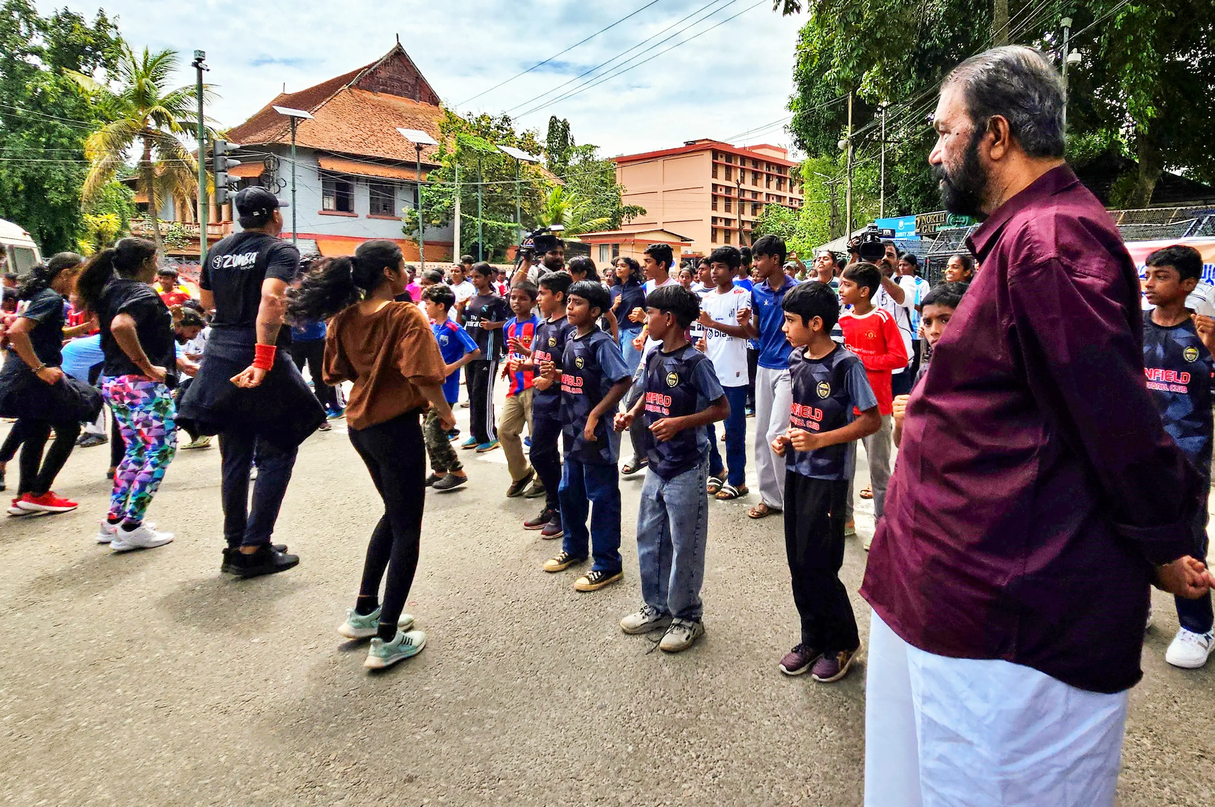 Kerala Minister for General Education V Sivankutty watches as students perform Zumba dance in front of the state Secretariat, in Thiruvananthapuram | PTI