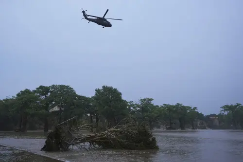 A helicopter flies over the Guadalupe River after a flash flood swept through Kerrville, Texas, on Friday | Photo: AP