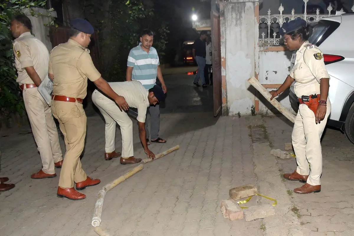 Police personnel during an investigation at an area after businessman Gopal Khemka was allegedly shot dead when he was returning home, in Patna | PTI