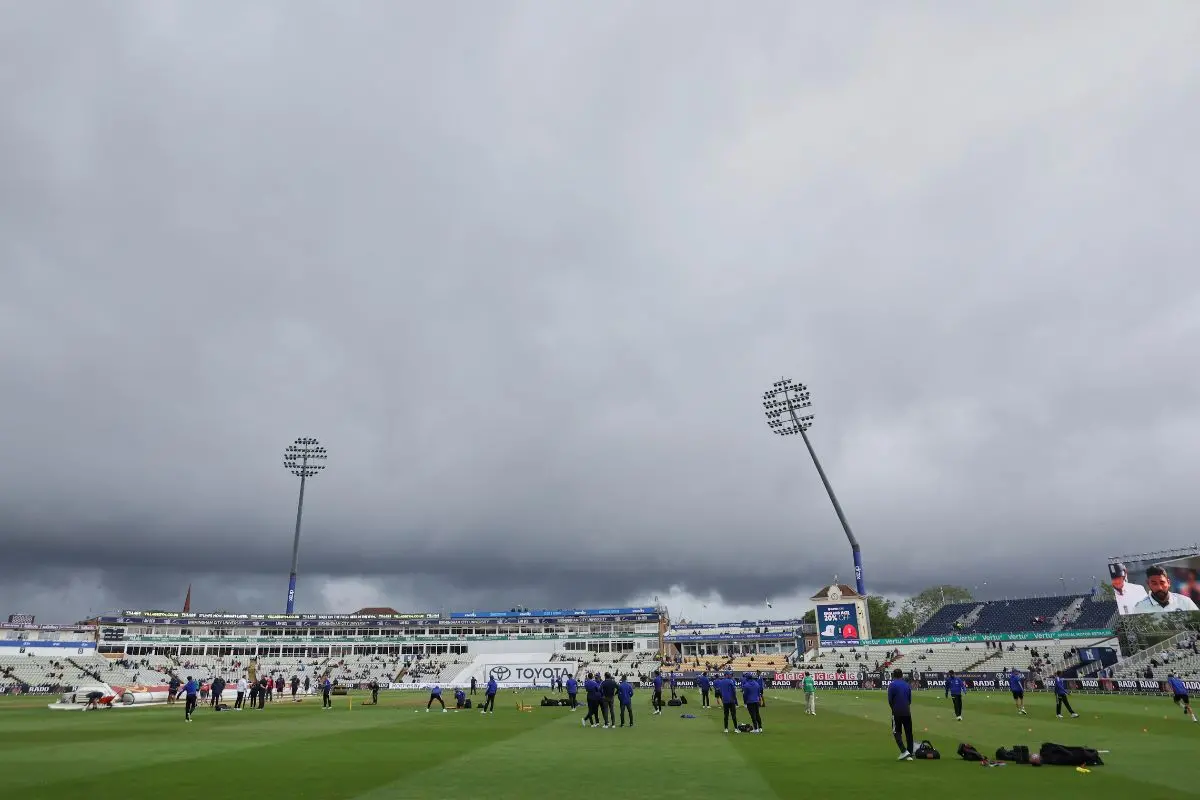 Dark clouds loom over Edgbaston cricket ground as players train before the start of play on day five of the second cricket test match between England and India in Birmingham. | Photo: AFP