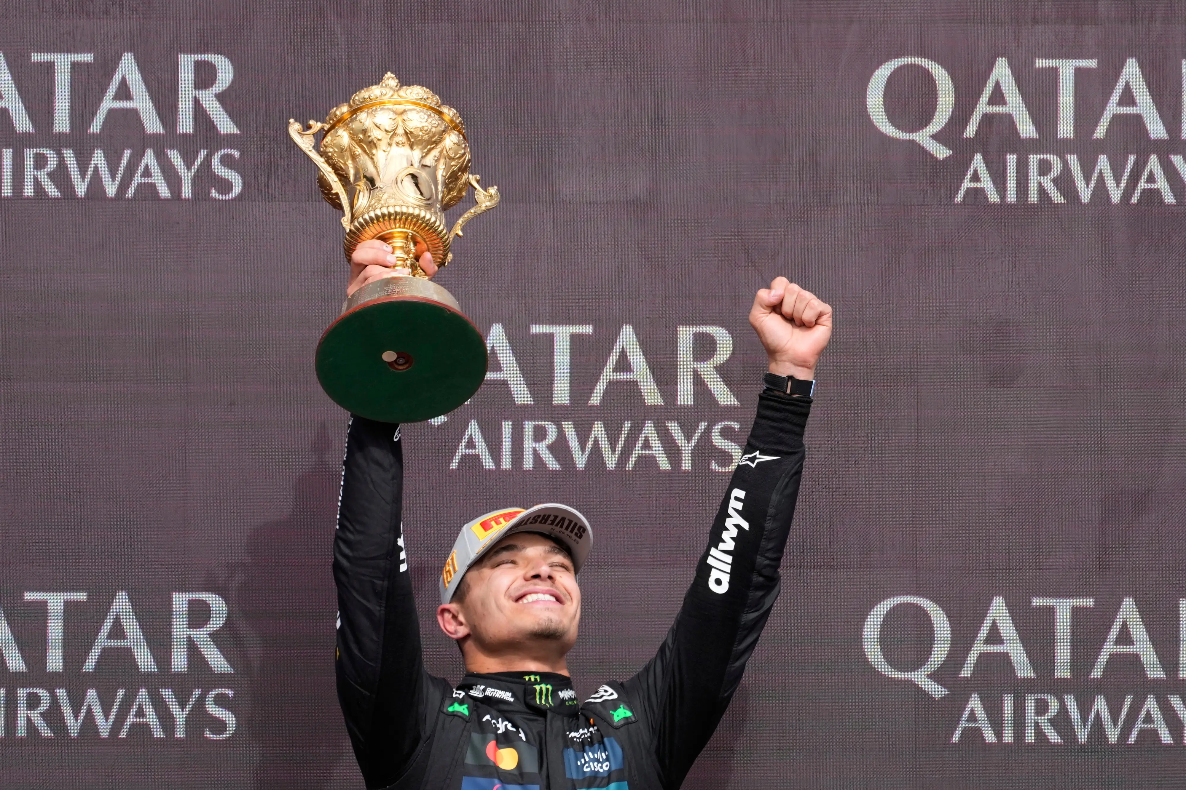McLaren driver Lando Norris of Britain holds the trophy as he celebrates winning the British Formula One Grand Prix race at the Silverstone racetrack | Photo: AP