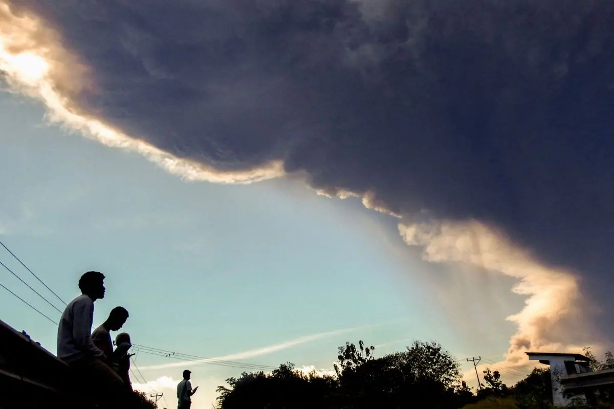 Villagers observe Mount Lewotobi Laki-laki as it erupts | AFP