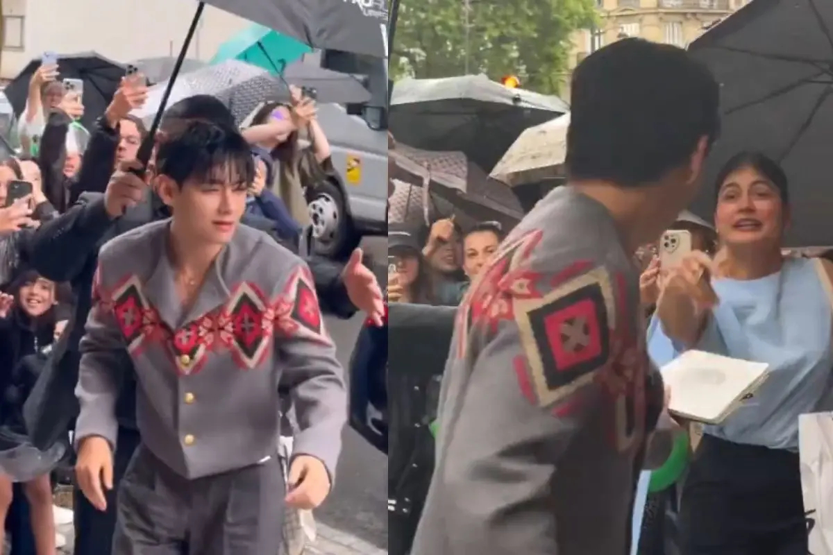 BTS`s V holding a fan`s sketchbook