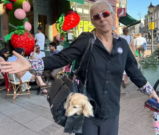 Martina Navratilova arriving with her pet dog, Lulu | @X