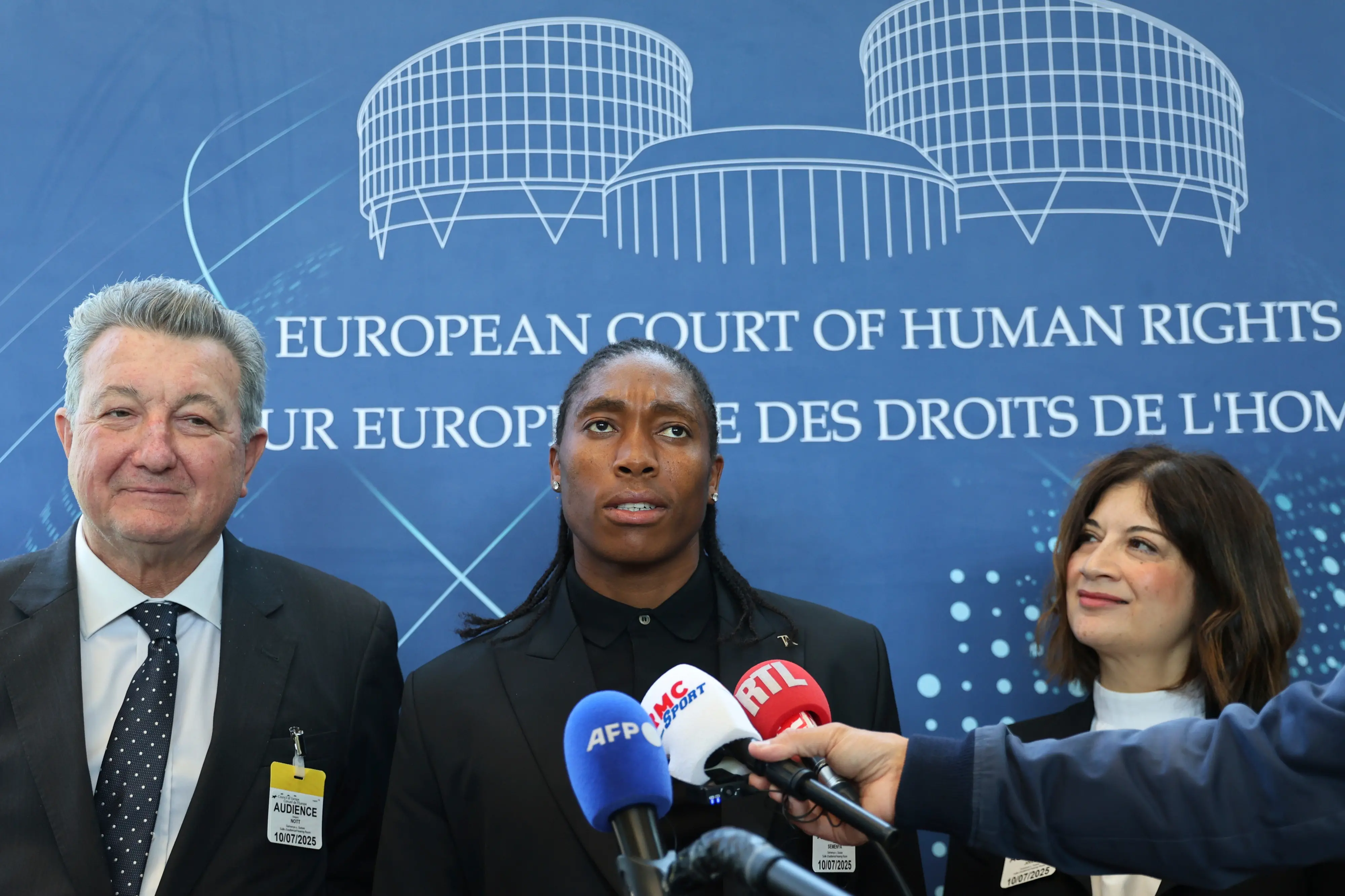 South Africa's Caster Semenya, center, answers reporters with lawyers Gregory Nott, left, and Shona Jolly KC after Semenya won a partial victory at the European Court of Human Rights on in her seven-year legal fight against track and field's sex eligibility rules in Strasbourg, eastern France. | Photo: AP