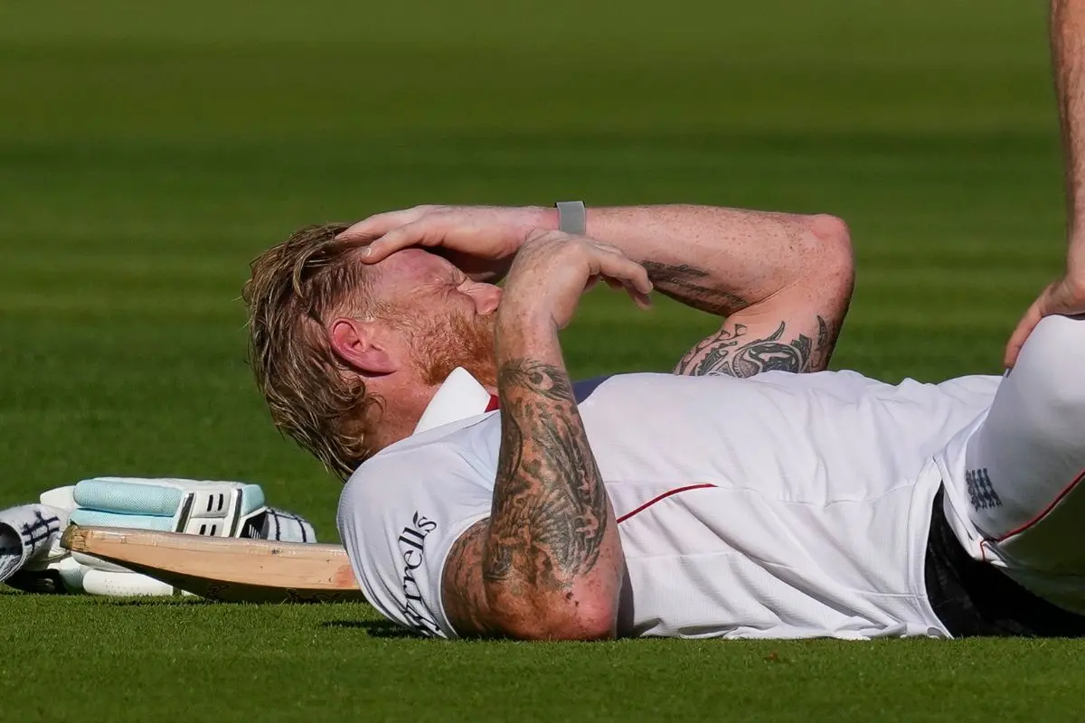 England's captain Ben Stokes being assisted by a physio due to muscle cramp on the first day of the third test cricket match between India and England, at the Lord's Cricket Ground in London. | Photo: PTI