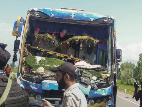 Security personnel stand near a damaged bus after a multi-vehicle collision at Khudwani, in Kulgam district, Jammu and Kashmir | Photo: PTI