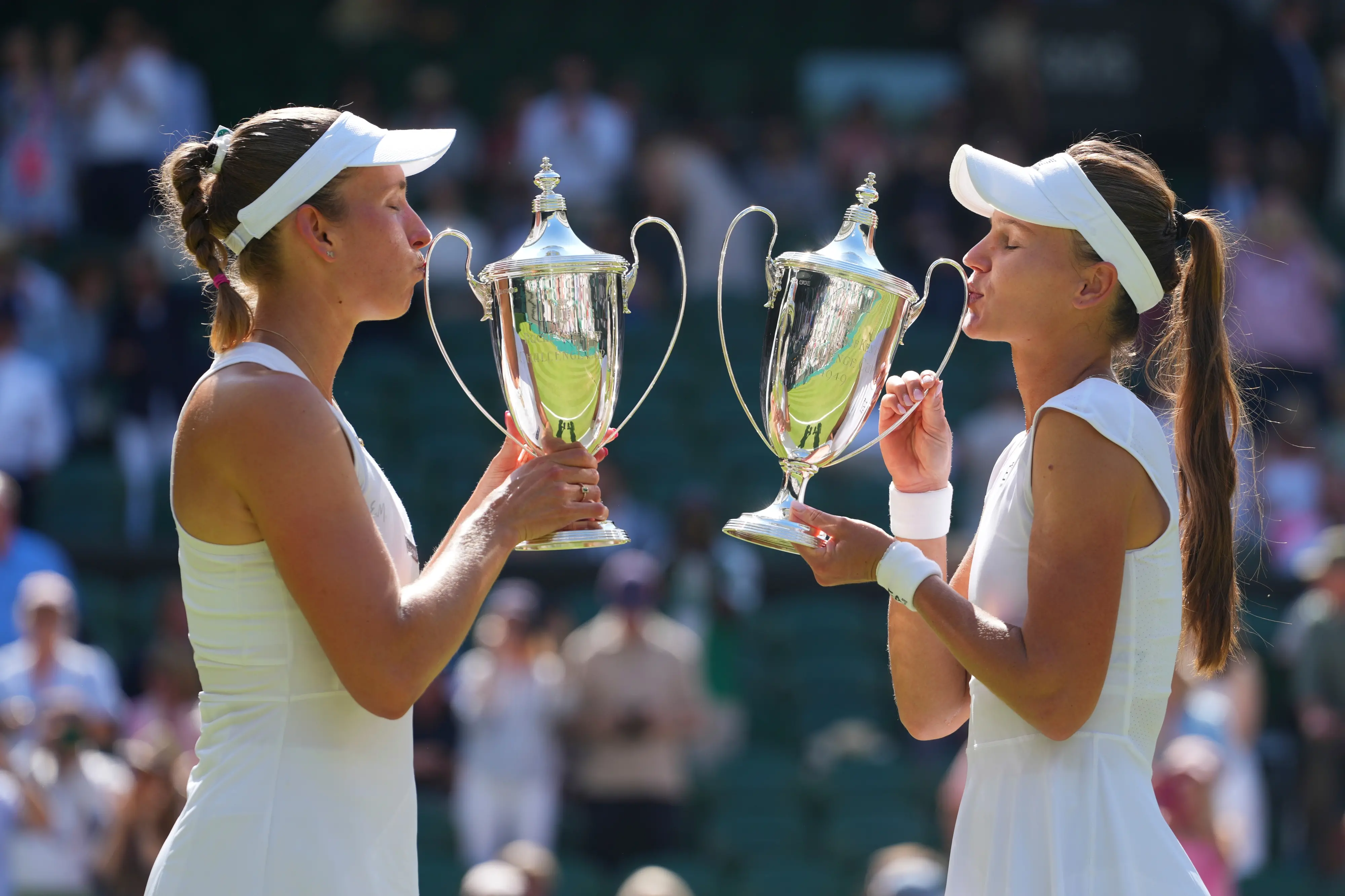 Veronika Kudermetova of Russia,right, and Elise Mertens of Belgium celebrate with the trophies | AP
