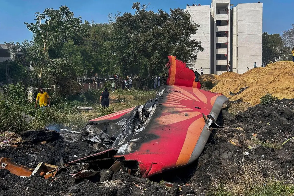 In this Thursday, June 12, 2025 file photo, charred remains of the Air India plane, that crashed into a medical hostel and its canteen complex moments after taking off from the Sardar Vallabhbhai Patel International Airport, lies on the ground, in Ahmedabad. | Photo: PTI