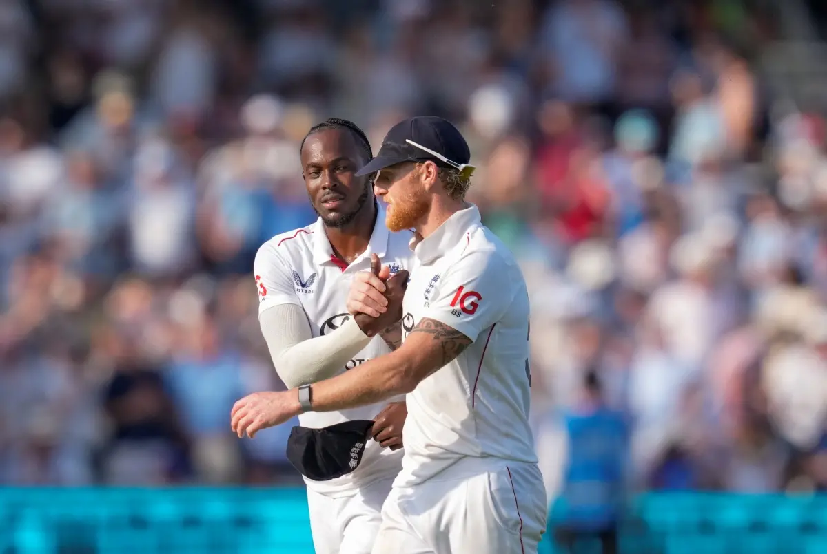 England's bowler Jofra Archer celebrates with captain Ben Stokes after taking the wicket of India's batter Washington Sundar during the third day of the third Test match between India and England, at the Lord's Cricket Ground in London. | Photo: PTI