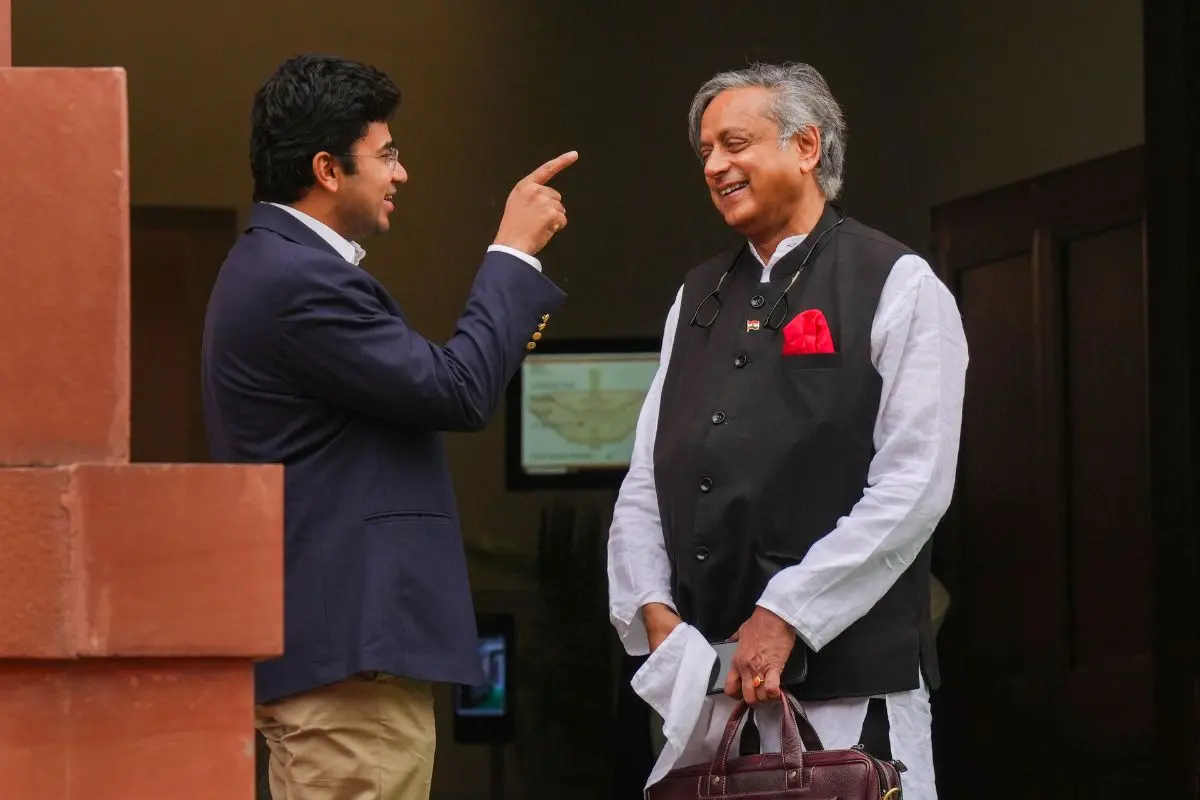 Congress MP Shashi Tharoor with BJP MP Tejasvi Surya during the first day of the Monsoon session of Parliament, in New Delhi | Photo: PTI