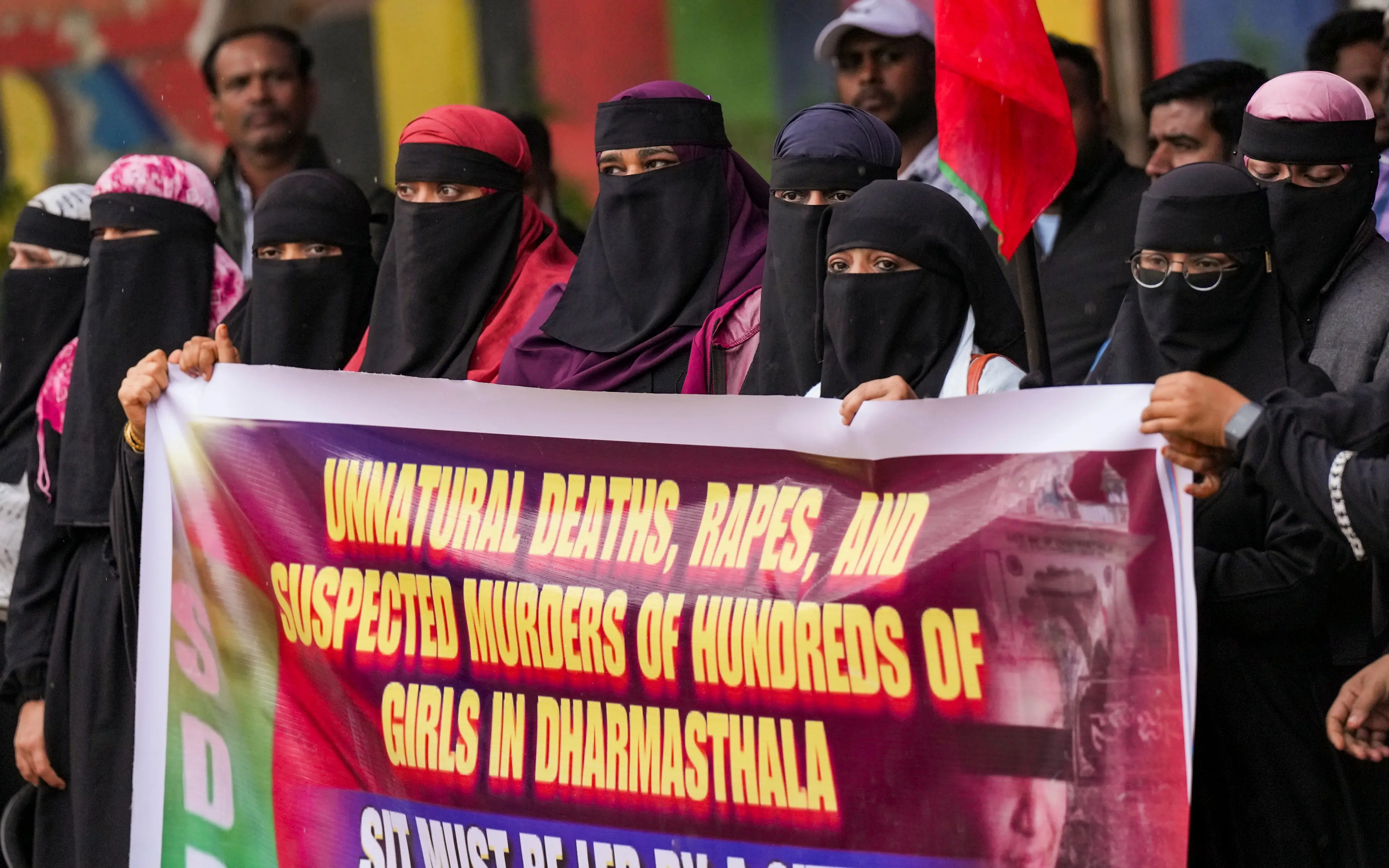 Members of the Social Democratic Party of India (SDPI) hold a banner during their protest demanding an investigation in the alleged 'unnatural deaths, rapes and suspected murders of many women in Dharmasthala', in Bengaluru, Karnataka | Photo: PTI