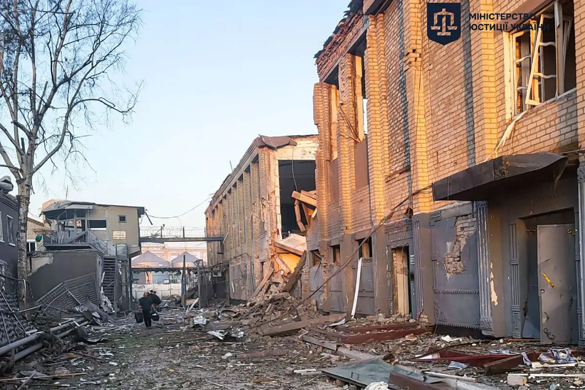 This handout photograph taken and released by the Ukrainian Justice Ministry on July 29, 2025, shows a man walking among debris next to a destroyed building of the Bilenkivska correctional colony following an air attack in Bilenke, Zaporizhzhia region, amid the Russian invasion of Ukraine. | Photo: AFP