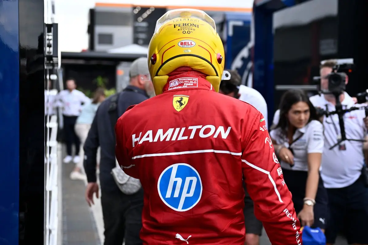 Ferrari driver Lewis Hamilton of Britain walks back to his pits after failing to complete during the qualifying session for the Hungarian Formula One Grand Prix at the Hungaroring racetrack in Mogyorod, Hungary. | Photo: AP