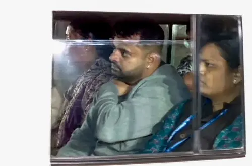 Suspended Janata Dal (Secular) (JD-S) MP Prajwal Revanna, who was arrested by SIT in the alleged obscene video case at the Bengaluru Airport after he landed, being brought to the CID office, in Bengaluru on Thursday. (ANI Photo)