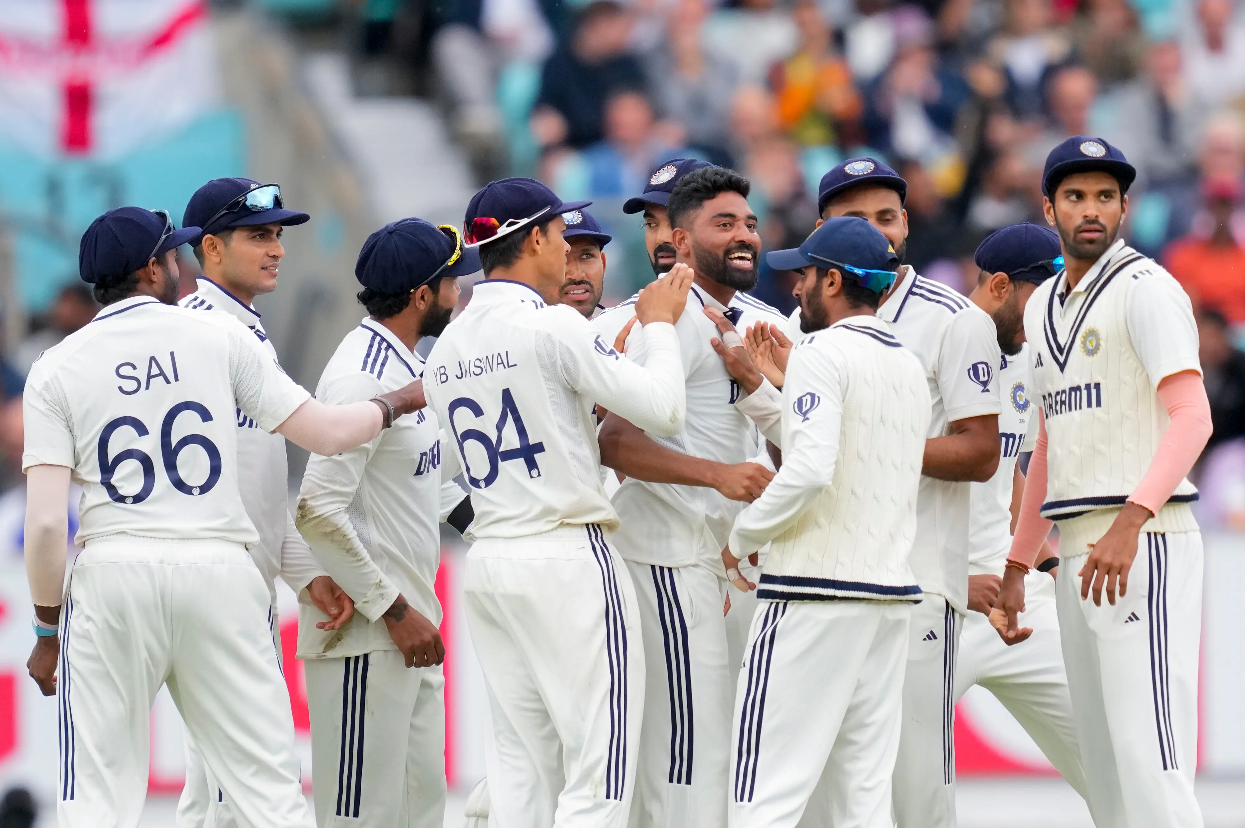 India's Mohammed Siraj celebrates with teammates after taking the wicket of England's Jamie Overton during the fifth day of the fifth Test match between India and England, at The Oval cricket ground | Photo: PTI