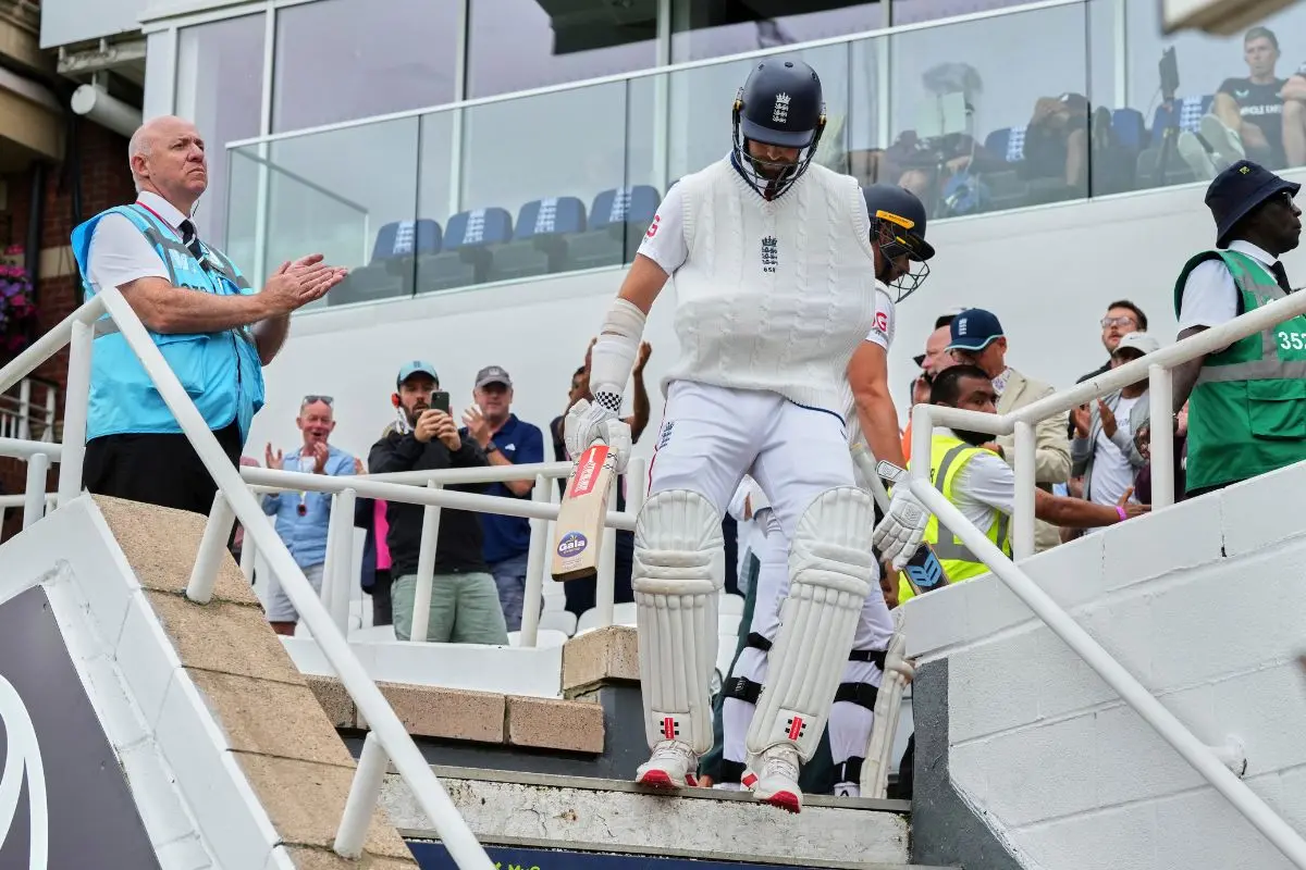 England's Chris Woakes comes out to bat with his arm in a sling after a shoulder injury earlier in the match on day five of the fifth cricket test match between England and India | Photo: AP