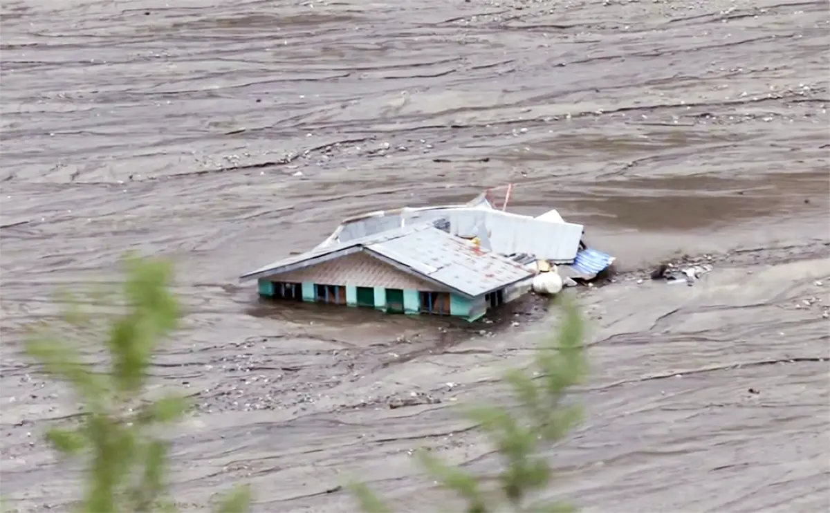 An aerial view of a house submerged with water at the site of Dharali cloudburst and mudslide in Uttarkashi. | Photo: ANI