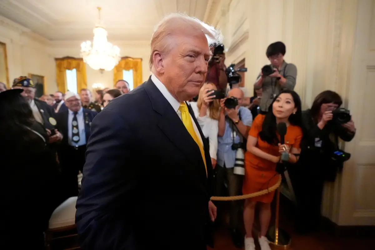 President Donald Trump departs an event to mark National Purple Heart Day in the East Room of the White House in Washington. | Photo: AP