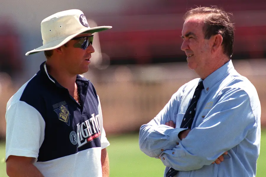 Australian cricketer Shane Warne, left, talks with former Australian coach Bob Simpson