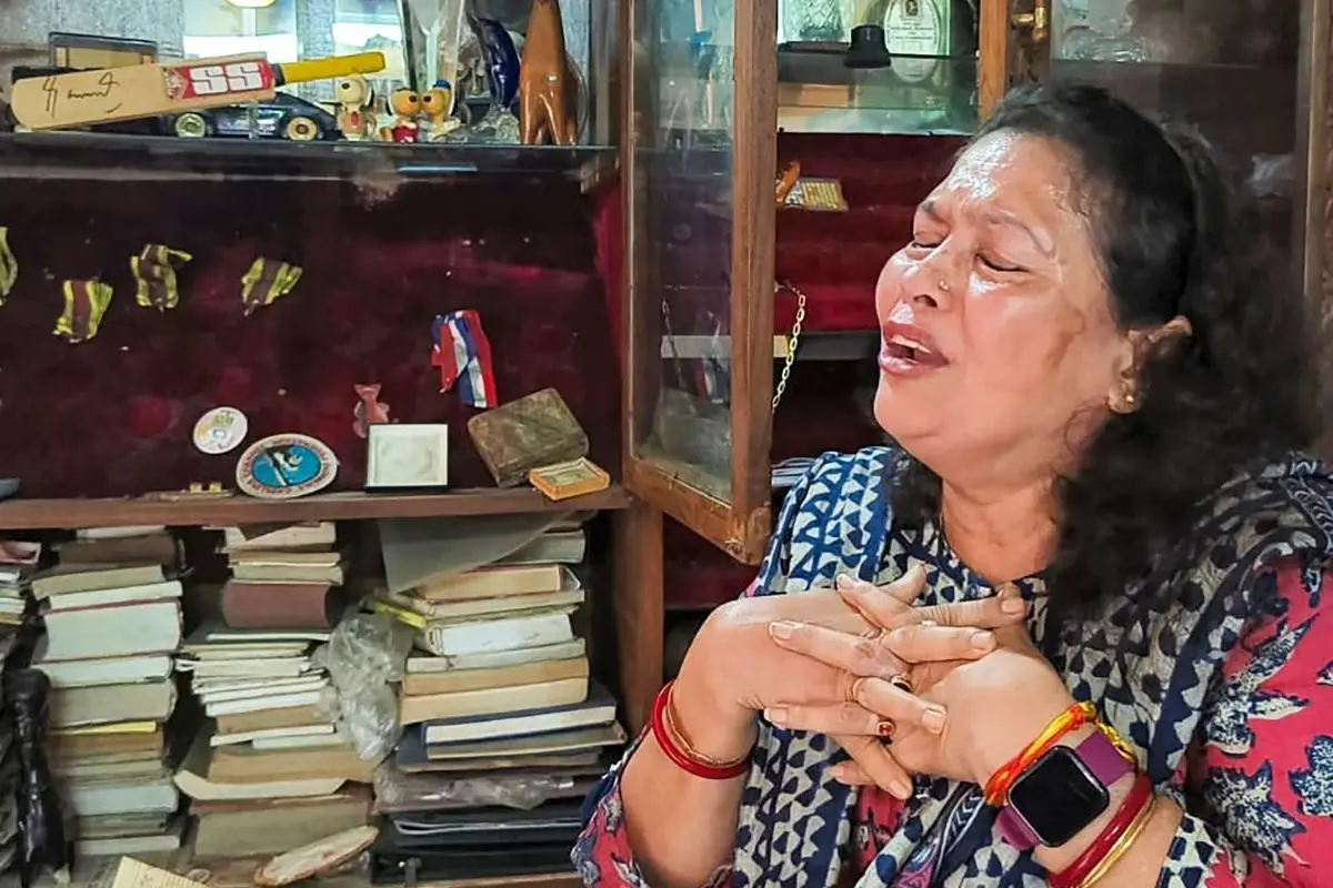 Former swimmer and Padma Shri awardee Bula Chowdhury breaks down in tears after her medals and mementoes were stolen from her ancestral home, in Hooghly district, West Bengal, Friday, Aug. 15, 2025. Photo: PTI