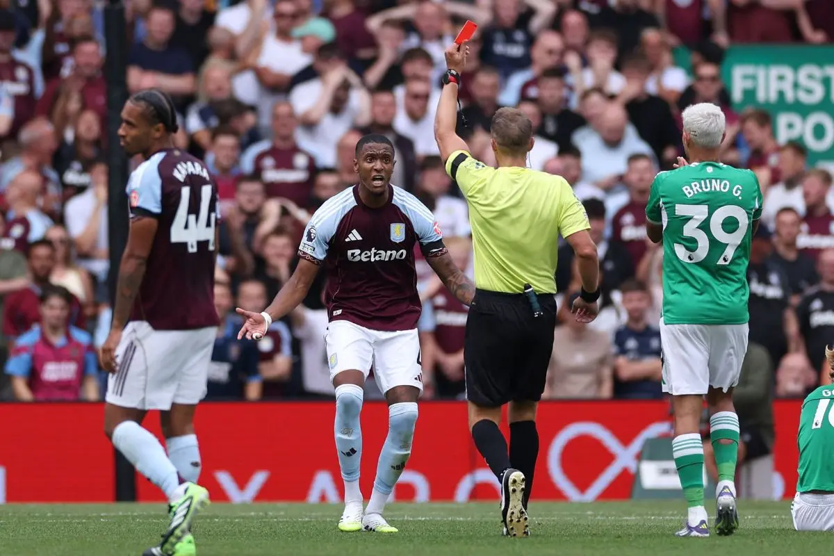 English referee Craig Pawson shows a red card to Aston Villa's English defender No.04 Ezri Konsa during the English Premier League football match between Aston Villa and Newcastle United at Villa Park in Birmingham | Photo: AFP