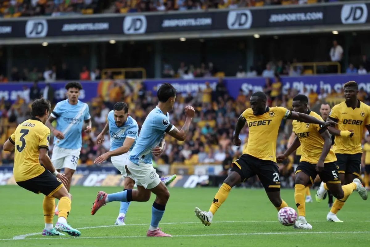 Manchester City's French midfielder #10 Rayan Cherki (3L) scores their fourth goal during the English Premier League football match between Wolverhampton Wanderers and Manchester City at the Molineux stadium in Wolverhampton, central England on August 16. Photo: AFP