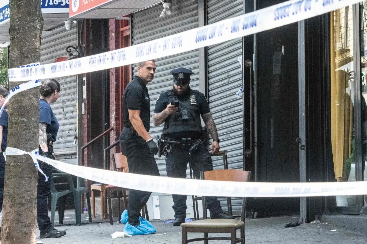 Members of the New York City police department (NYPD) investigate a shooting scene at Taste of the City lounge on August 17, 2025, in the Crown Heights neighborhood of the Brooklyn borough in New York City. Photo: AFP