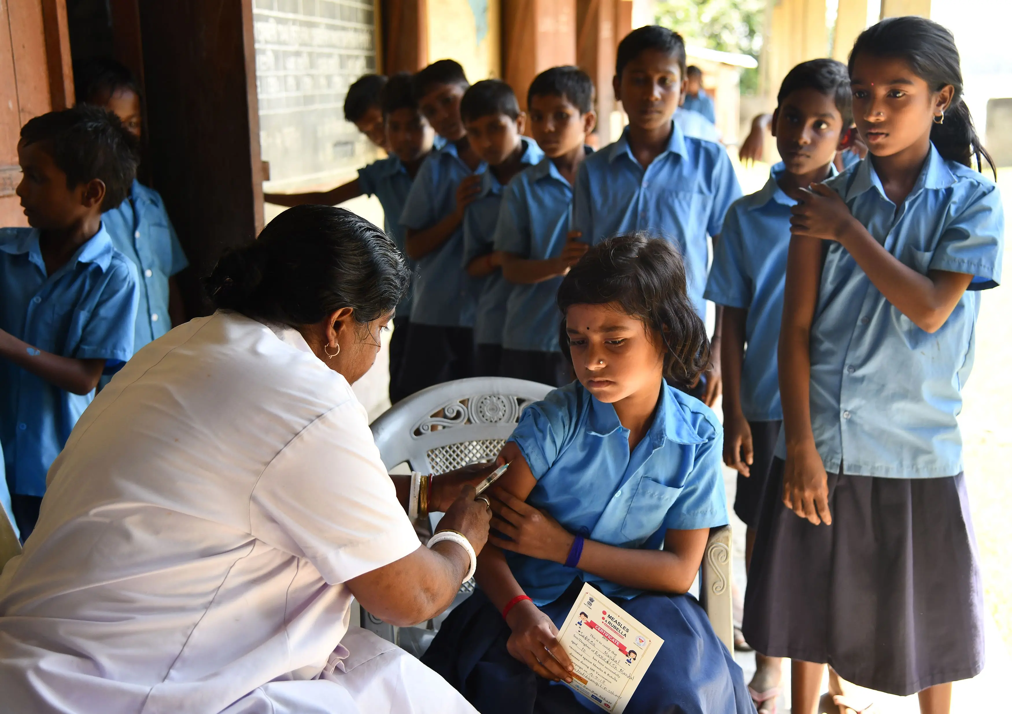 An India health worker injects a measles and rubella (MR) vaccine to a student at a government school in Assam | Photo (File): AFP