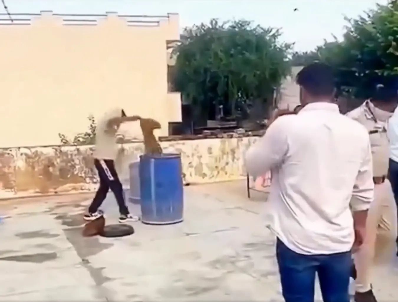 Video screengrab of the dead man's body being retrieved from the drum | X