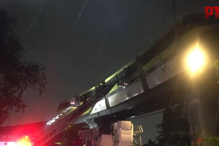 Rescue teams assist stranded passengers inside Mumbai Monorail during ongoing operation.