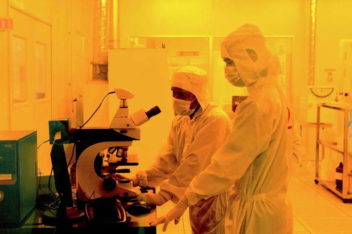 Researchers wearing bunny suits work inside the semiconductor fabrication lab | Photo: AFP