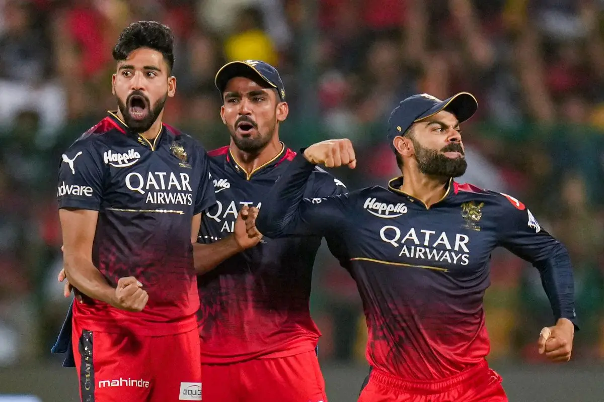 Mohammed Siraj and Virat Kohli celebrate on the field. | File Photo: PTI