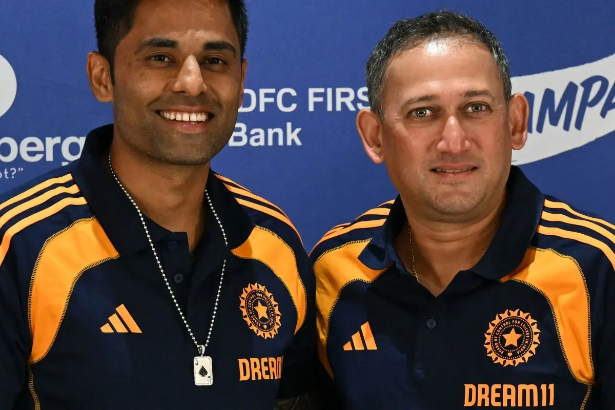 Indian cricket captain Suryakumar Yadav (L) and Ajit Agarkar chairman of Board of Control for Cricket in India (BCCI) selection committee