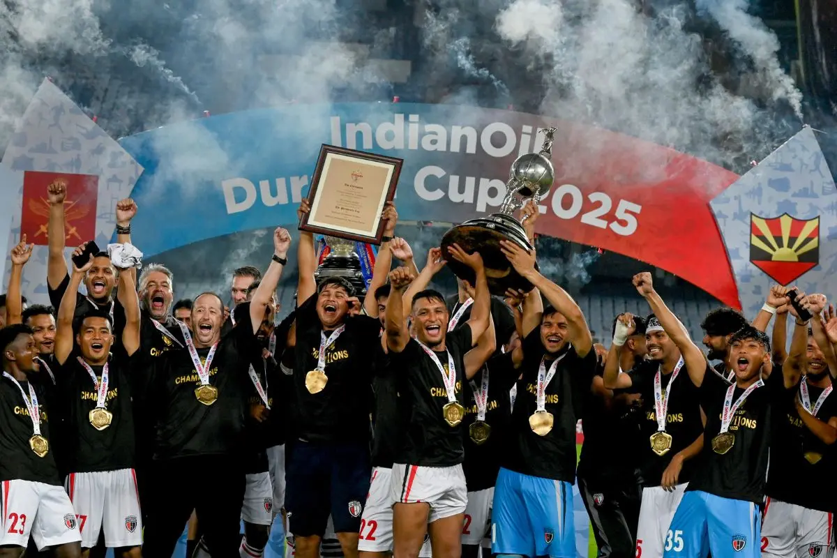 NorthEast United FC's players celebrate with the trophy after winning the Durand Cup 2025, at Vivekananda Yuba Bharati Krirangan, in Kolkata | Photo: PTI