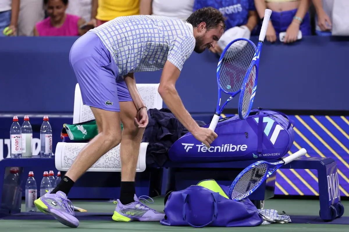 Daniil Medvedev breaks his racket after losing in five sets to Benjamin Bonzi of France during their Men's Singles First Round match on Day One of the 2025 US Open at USTA Billie Jean King National Tennis Center in the Flushing neighborhood of the Queens borough of New York City. | Photo: AFP