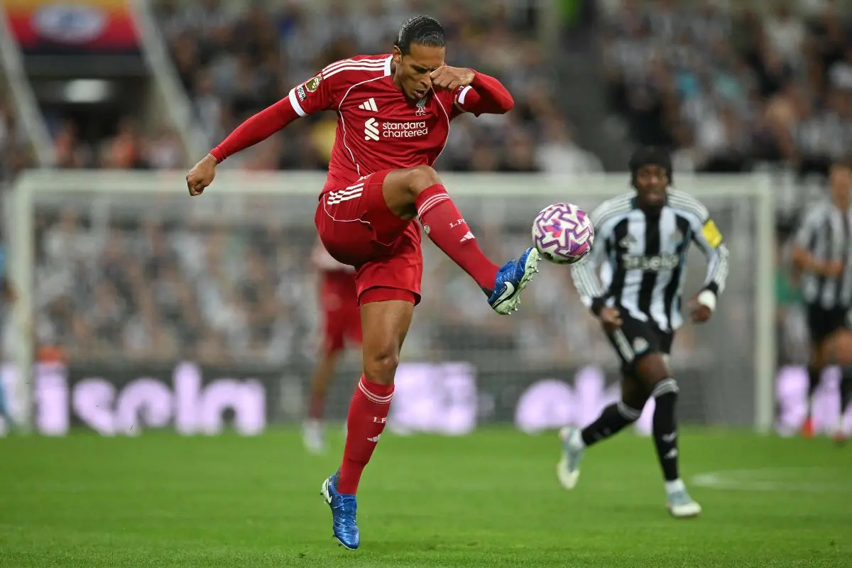 Liverpool's Dutch defender #04 Virgil van Dijk clears the ball during the English Premier League football match between Newcastle United and Liverpool | Photo: AFP