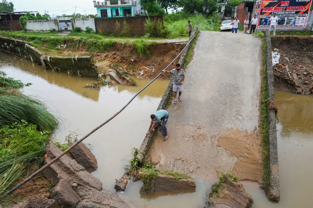 A portion of a bridge damaged following heavy rainfall, in Jammu, Monday, Aug. 25, 2025. (PTI Photo)