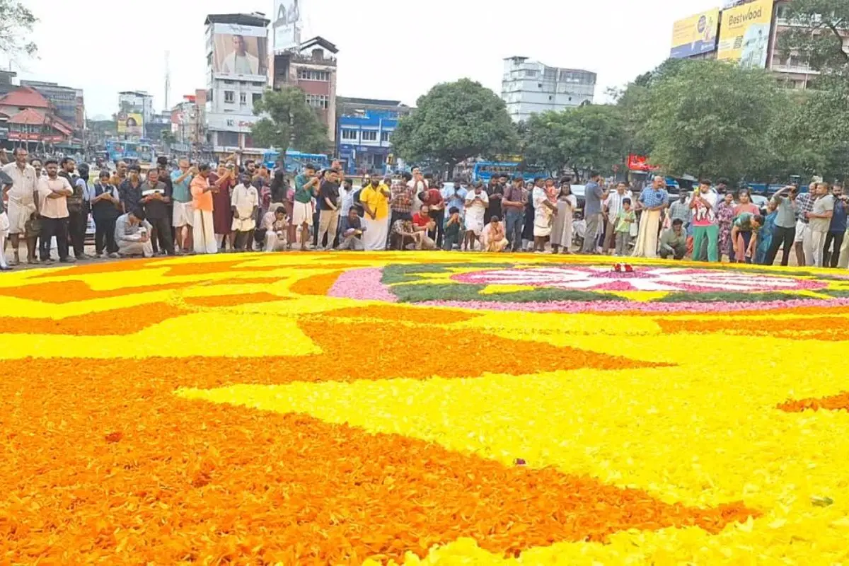 A breathtaking 60-ft Pookkalam made with 1,500 kg of fresh flowers adorns Thrissur's Thekkinkadu Maidan on Atham day, marking the vibrant start of Onam celebrations. Photo: X