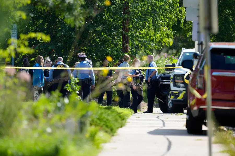 Law enforcement officers gather outside the Annunciation Church's school in response to a reported mass shooting, Wednesday, Aug. 27, 2025, in Minneapolis. | AP