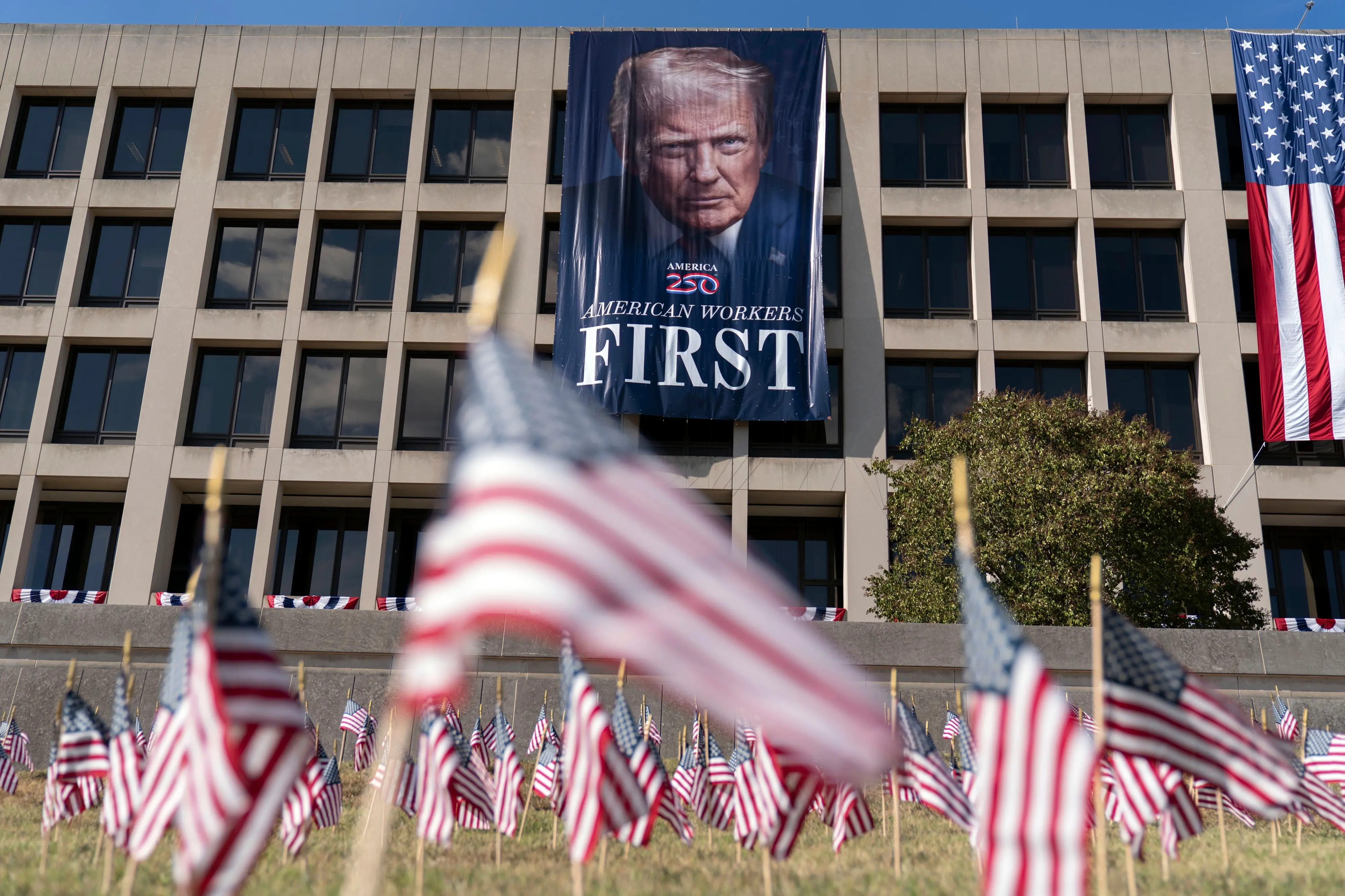 A portrait of President Donald Trump hangs on the Labor Department headquarters near the Capitol in Washington | Photo: AP