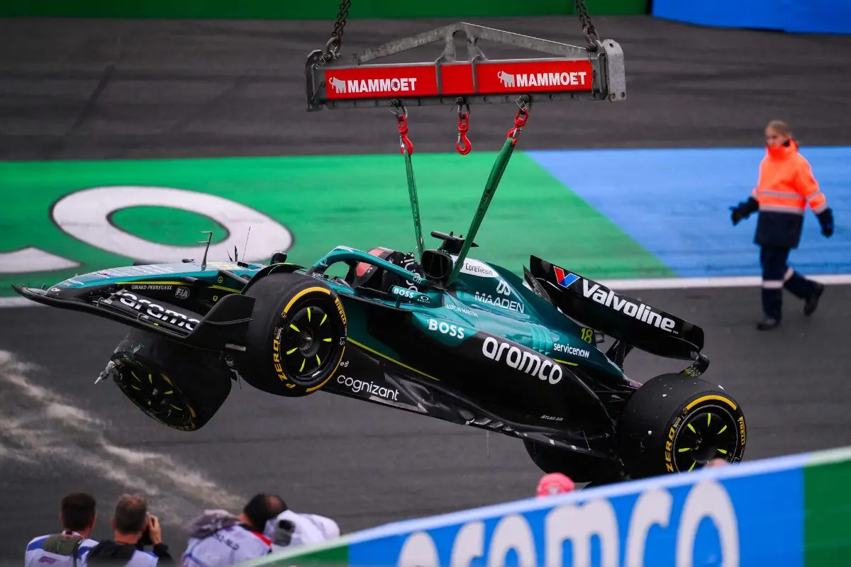 The car of Aston Martin's Canadian driver Lance Stroll is evacuated after he crashed during the second practice session ahead of the Formula One Dutch Grand Prix at The Circuit Zandvoort | Photo: AFP